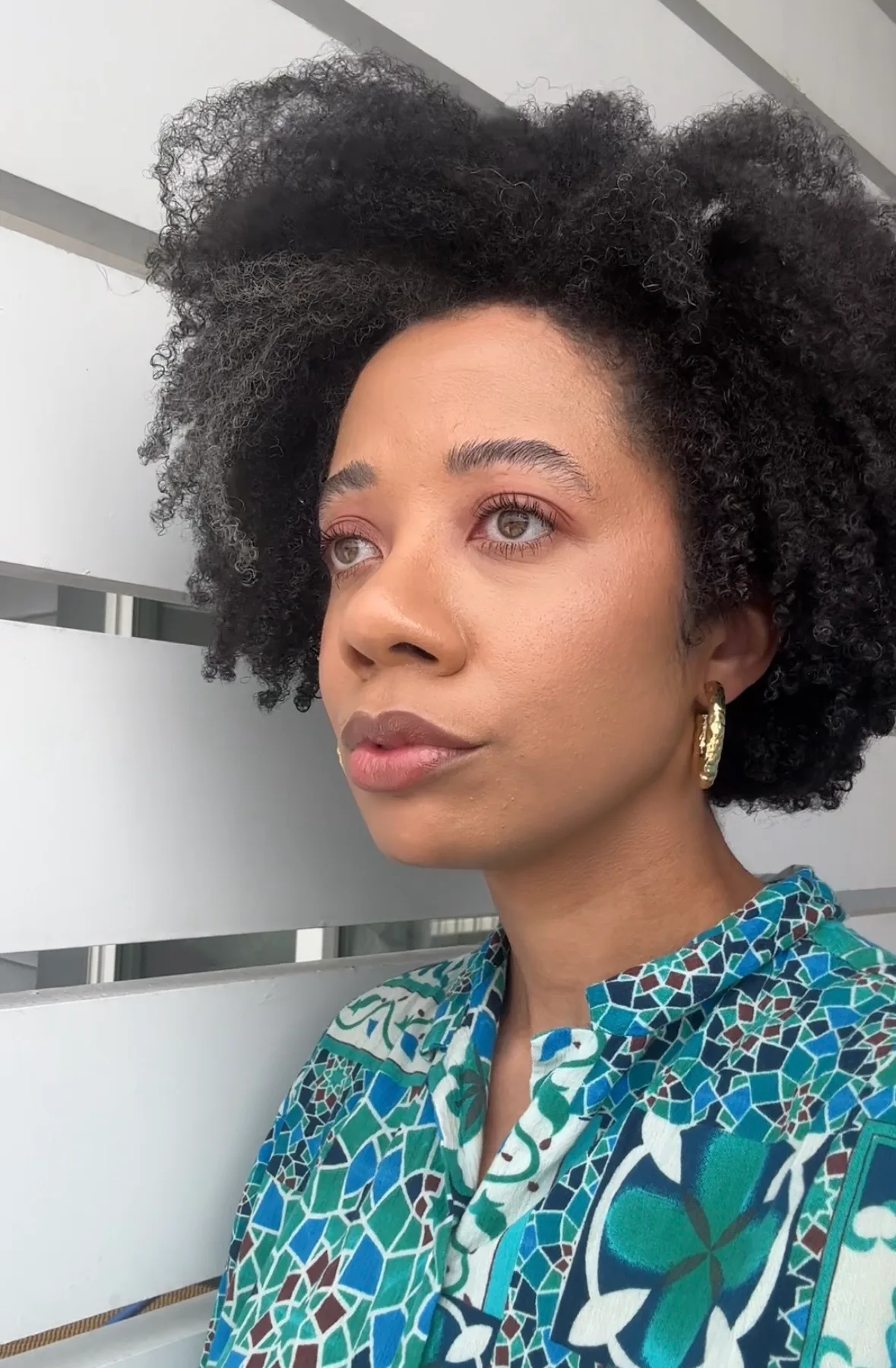 The author wearing the Red Carpet Skin Serum Foundation in close up and profile