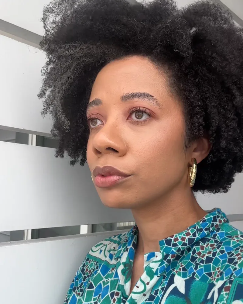 The author wearing the Red Carpet Skin Serum Foundation in close up and profile
