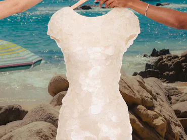 Collage of 2 women holding a shell mini dress by the hanger with beach background
