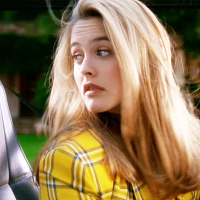 The movie "Clueless", written and directed by Amy Heckerling. Seen here, Alicia Silverstone as Cher (Cherilyn "Cher" Horowitz), learning to drive a Jeep Wrangler. Theatrical wide release, Friday, July 21, 1995. Screen capture. Paramount Pictures.