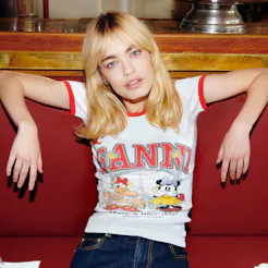 A girl wearing a shirt from GANNI x Disney's third and final Daisy Duck collaboration.