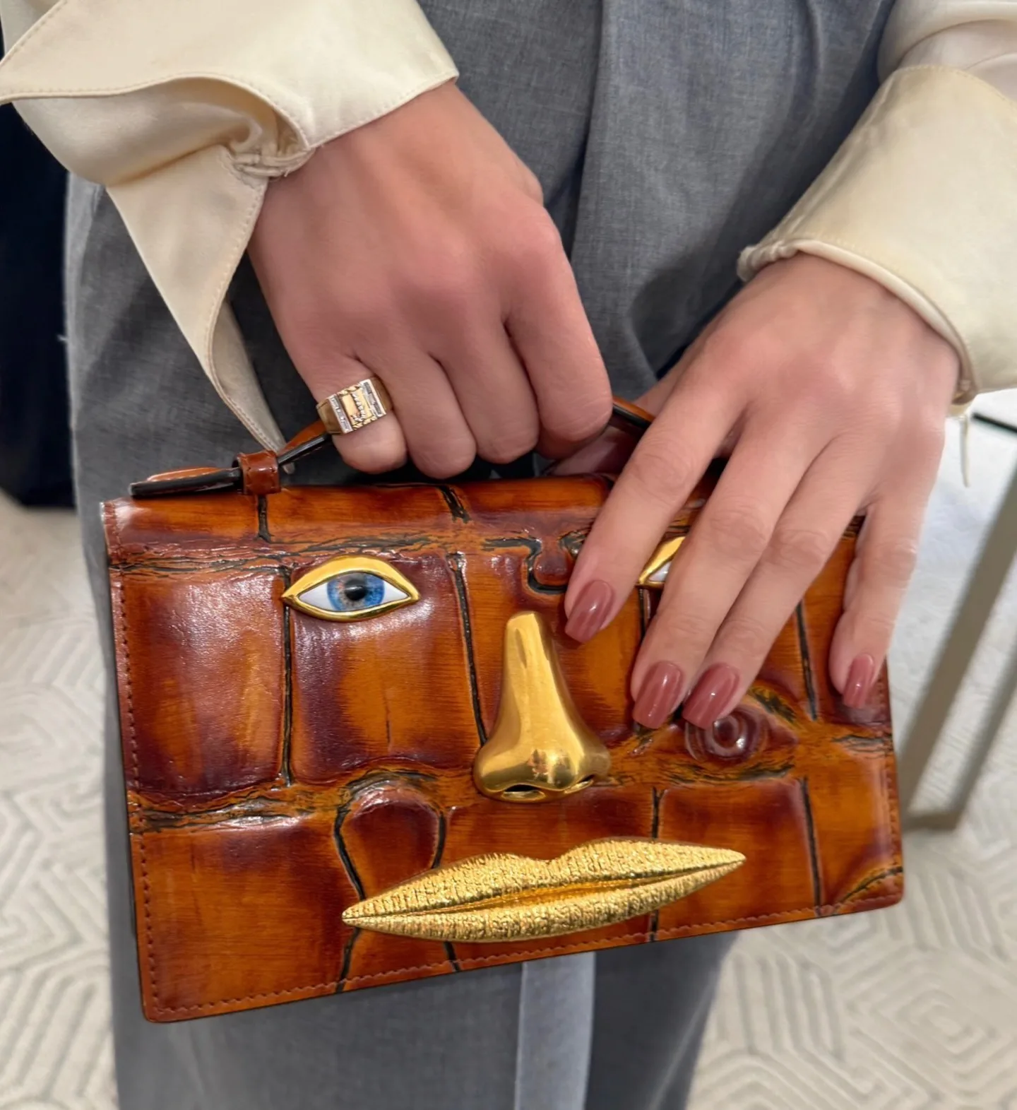 A cinnamon bronze manicure on Jennifer Lopez's hands