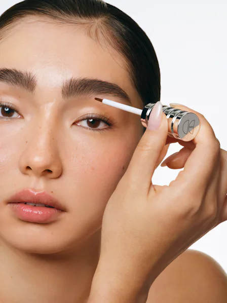 A model applies the Cécred Restoring Lash & Brow Builder