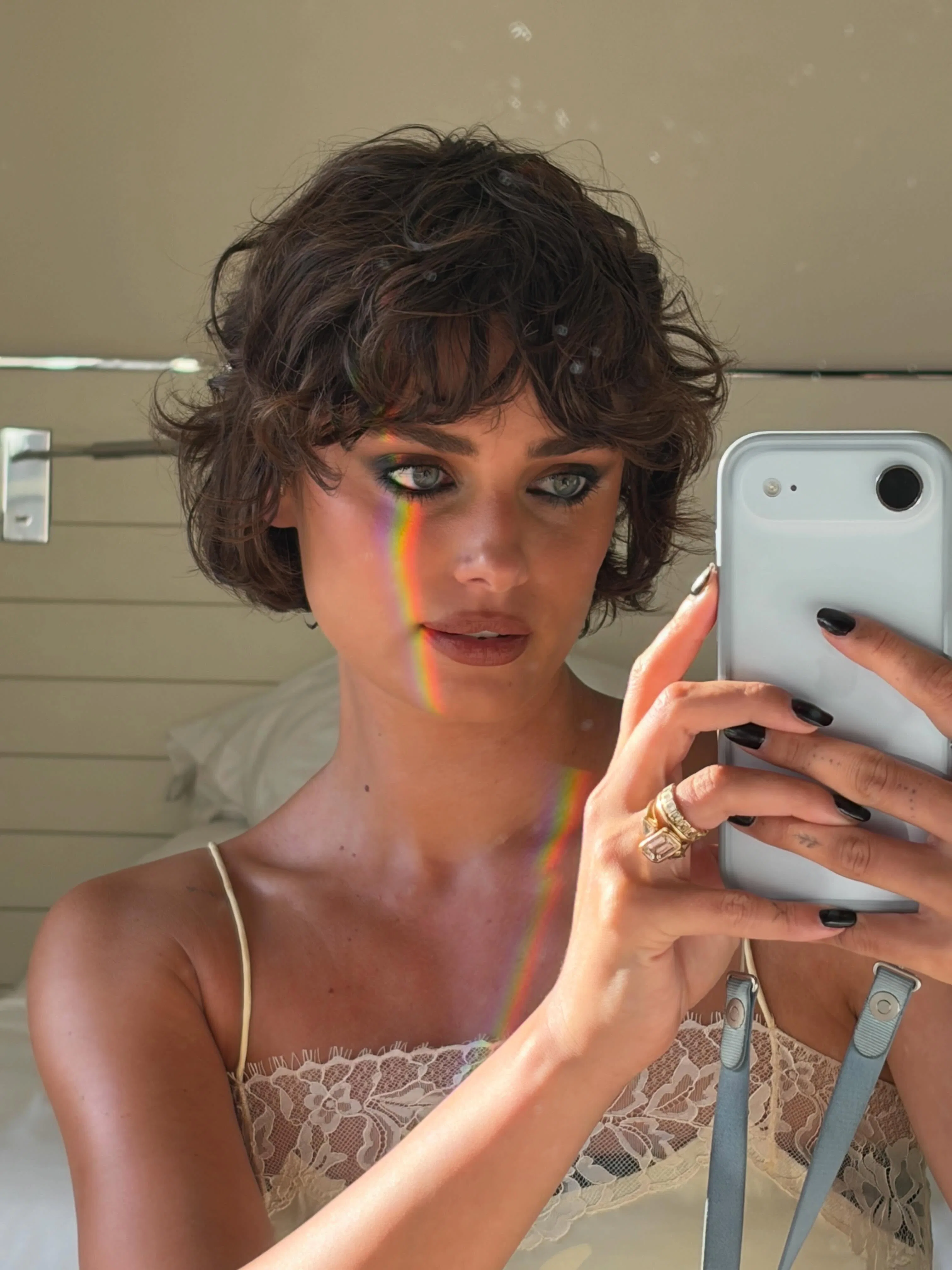 Model Taylor Hill with a tousled, grown-out pixie haircut