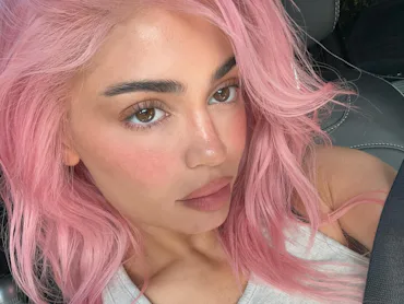 Kylie Jenner with pink hair in a car