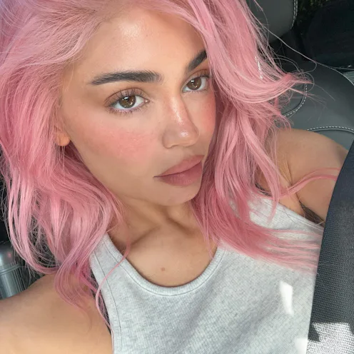 Kylie Jenner with pink hair in a car