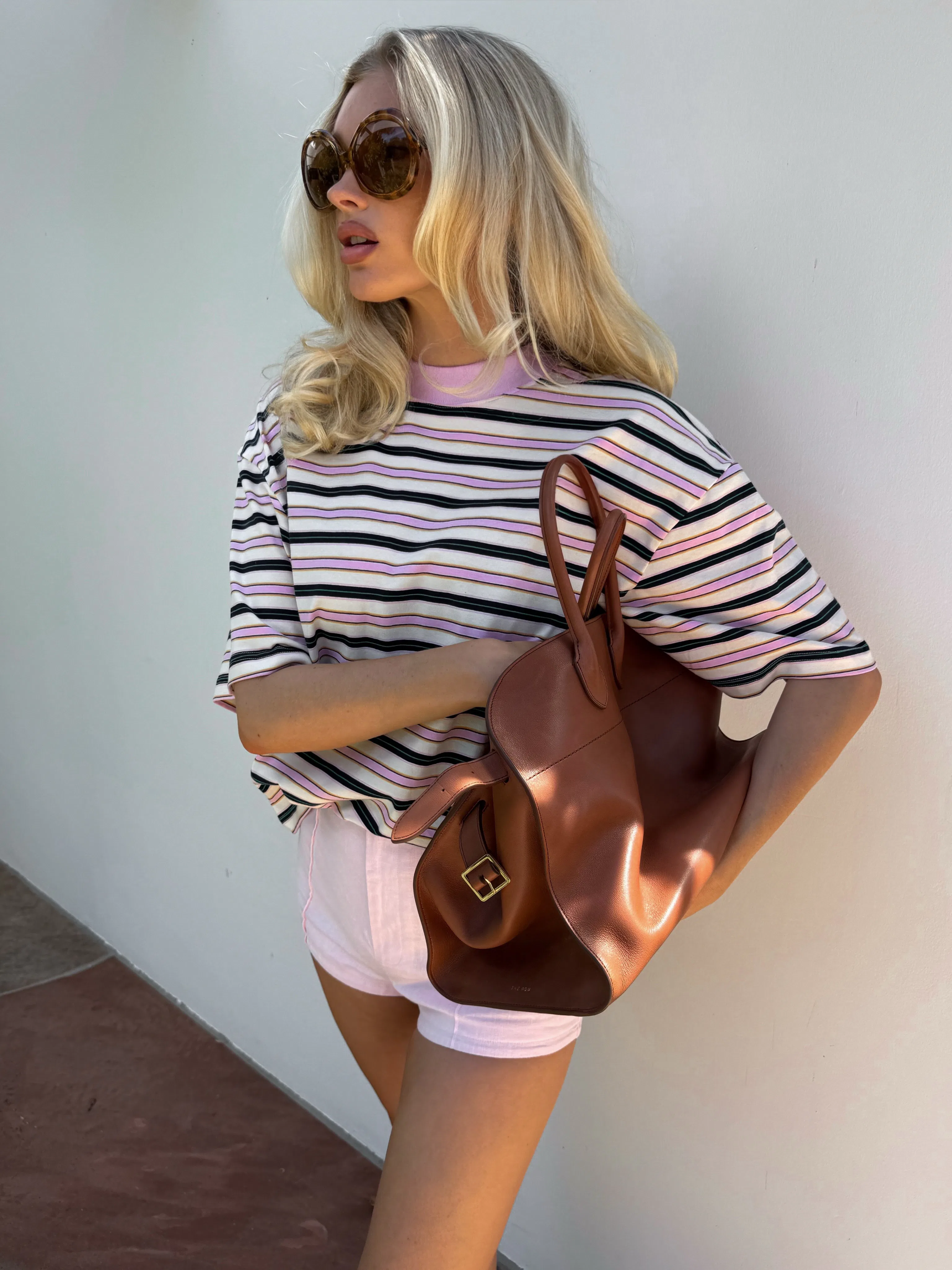 Elsa Hosk wears a pink striped T-shirt 