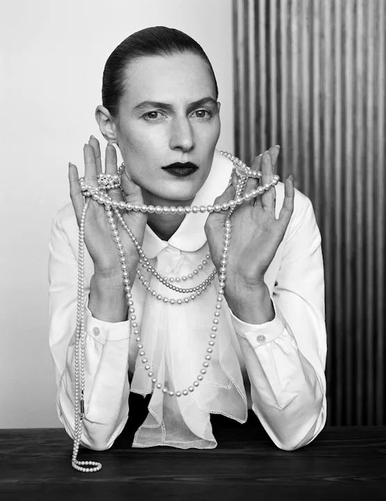 Black and white picture of Julia Nobis wearing pearls