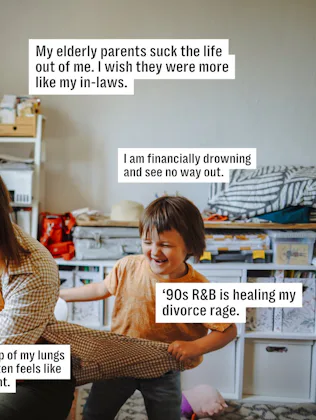 A woman tries to work at her desk while her kid pulls on her shirt.