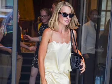 Margot Robbie is seen leaving the Hotel Ritz after lunch in Paris. She wore a light yellow silk cami...