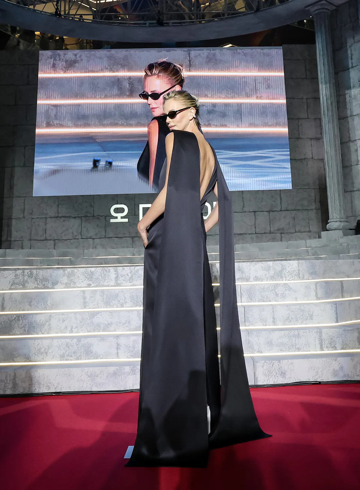 Charlize Theron Ends ‘The Odyssey’ Press Tour on a Futuristic Note
