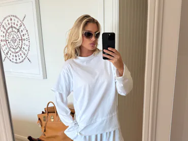 Elsa Hosk wears the "emo-core" tee over long-sleeved shirt.