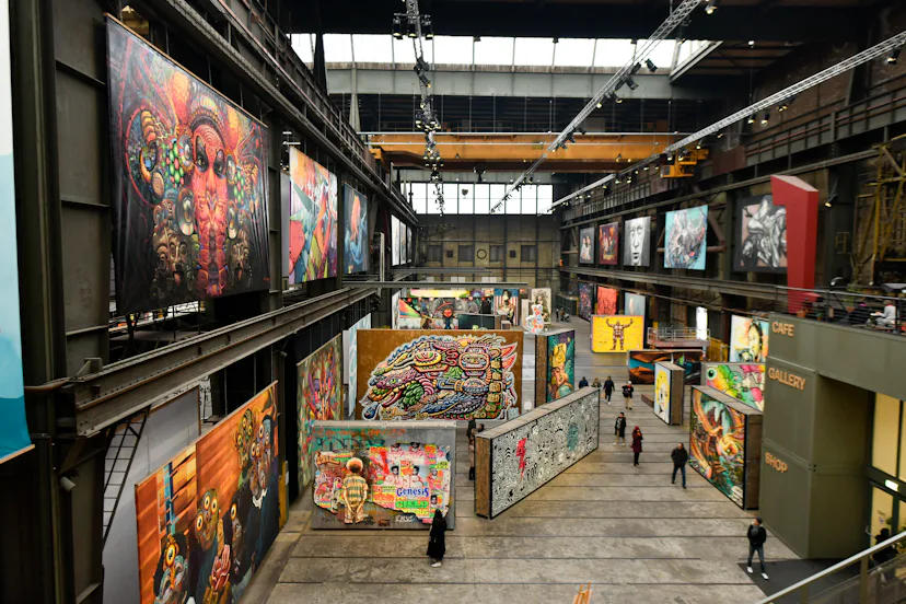 AMSTERDAM, NETHERLANDS - DECEMBER 11: General view of people looks the graffiti art inside the STRAA...