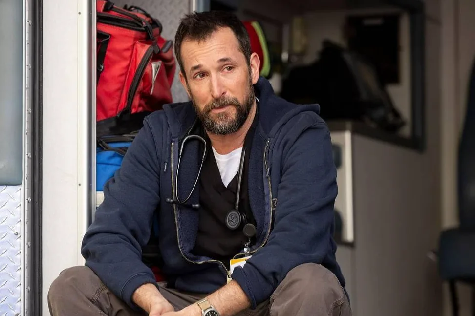 screen grab from the pitt of dr robby sitting on the back of an ambulance