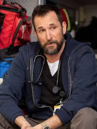screen grab from the pitt of dr robby sitting on the back of an ambulance