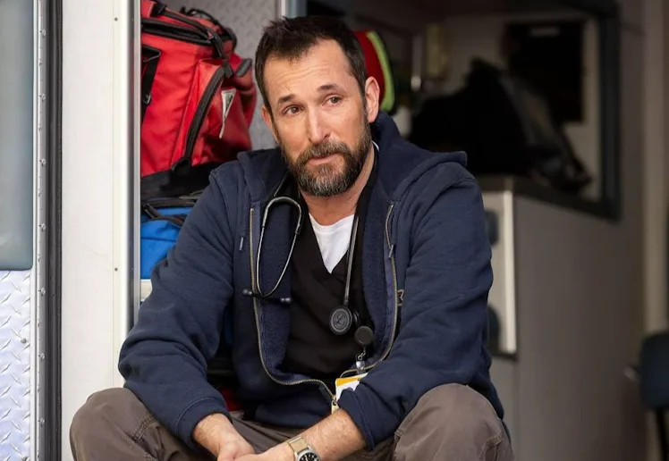 screen grab from the pitt of dr robby sitting on the back of an ambulance