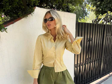 Elsa Hosk wears a yellow and green outfit, aka the "dirty martini" color trend.