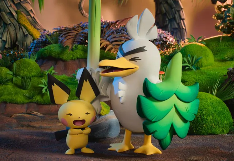 sirfetch'd and pichu laugh together in a forest setting in a still from the forthcoming show pokemon...