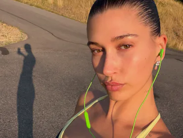 Hailey Bieber taking a selfie while on a jog