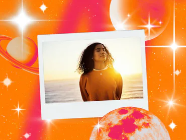 Young woman taking in the sunset after reading her October 2026 horoscope.