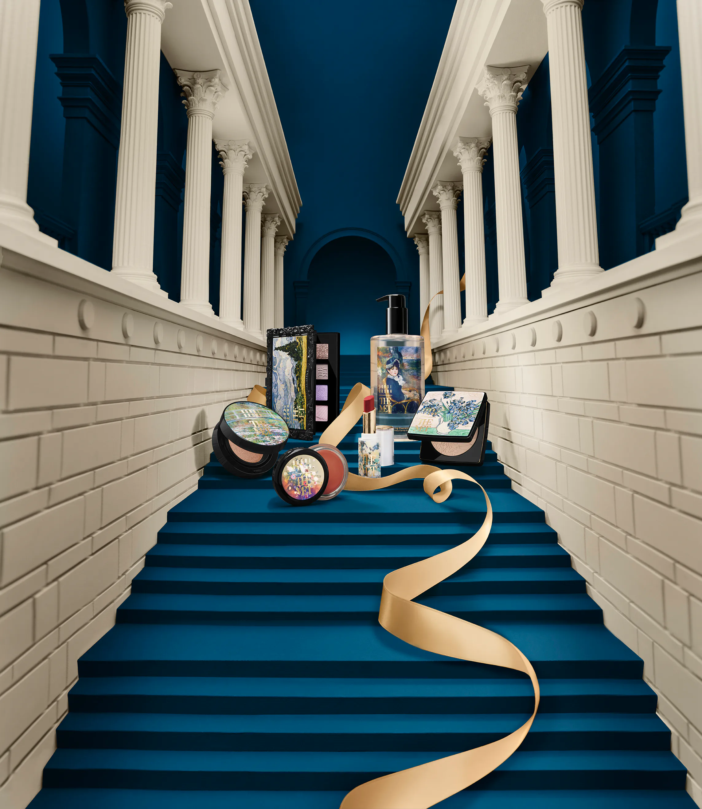 A selection of products from the bobbi brown x met collection, situated on the met stairs