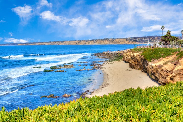 Sunny late afternoon at the popular scenic seaside town of La Jolla Cove beach in San Diego, Califor...