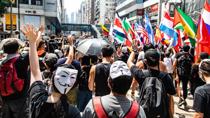 Two protesters with Guy Fawkes masks during the demonstration