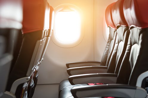 Black and red passenger seat on the airplane.