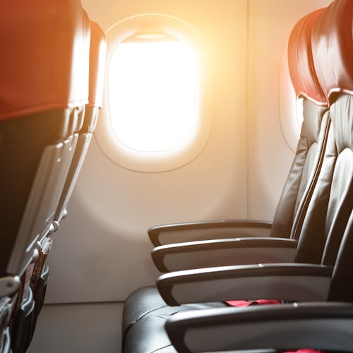 Black and red passenger seat on the airplane.