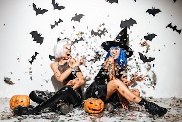 Pumpkin puns for Instagram are great for these two women throwing glitter in the air, dressed up in ...