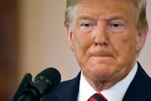 US President Donald J. Trump at a press conference in the East Room of the White House in Washington...