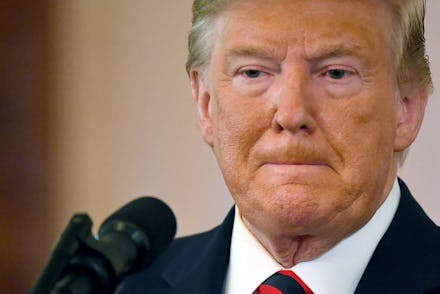 US President Donald J. Trump at a press conference in the East Room of the White House in Washington...