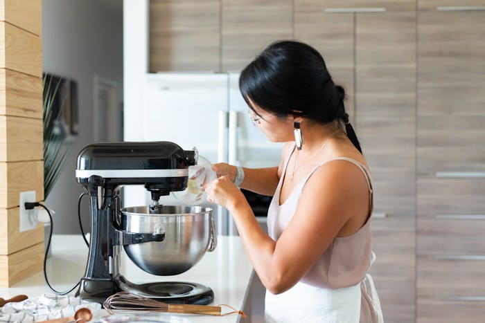 Woman Baking in the Kitchen Using KitchenAid mixer