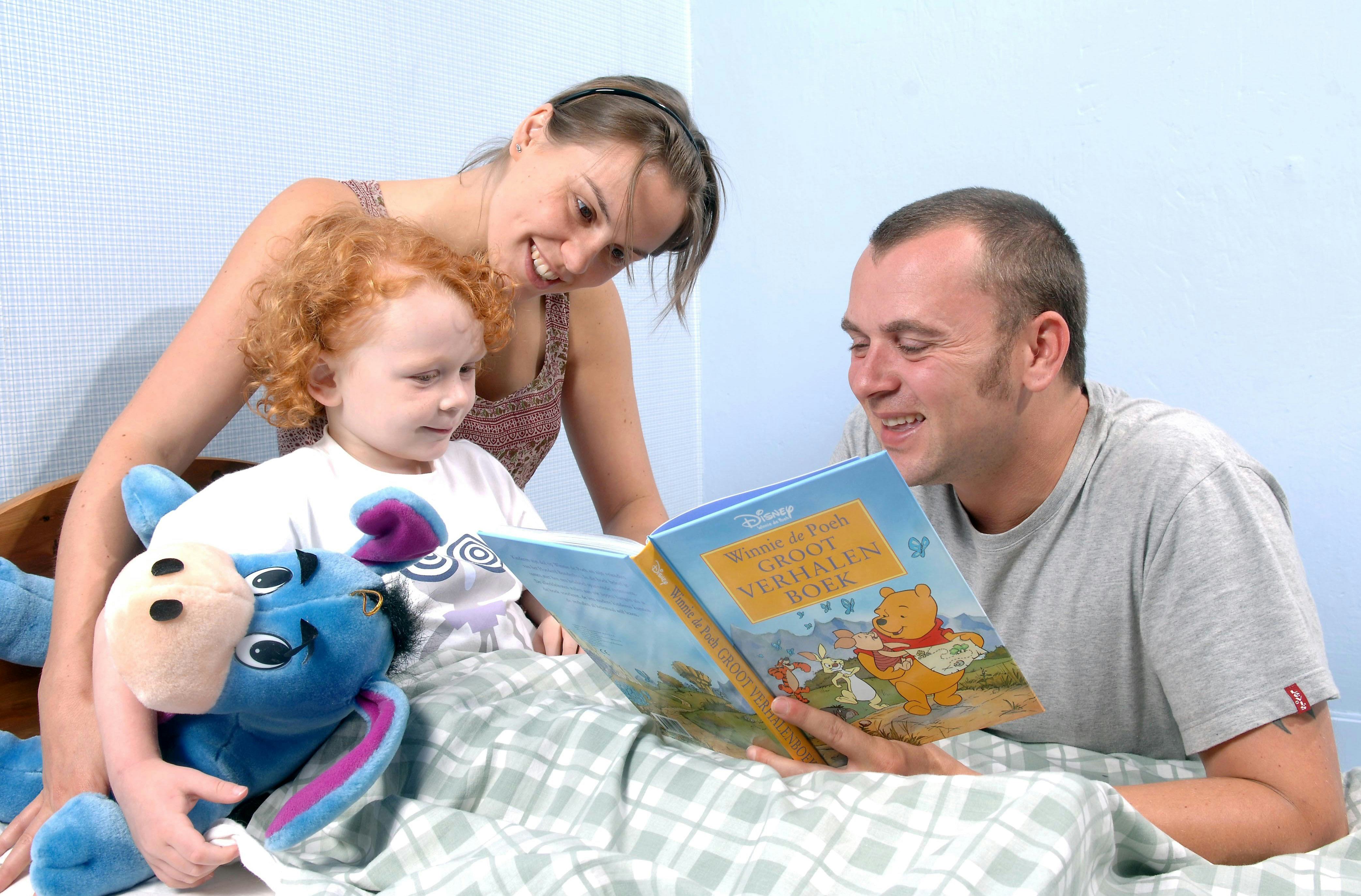 Model released - Parents reading child a bedtime story