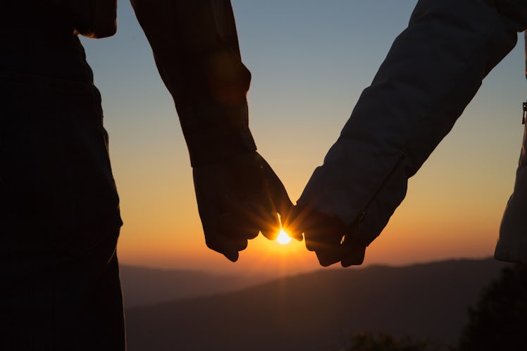 Couple in love, Focus on hands, Man and woman tourists in the mountains,  Happy couple in love,  Lov...