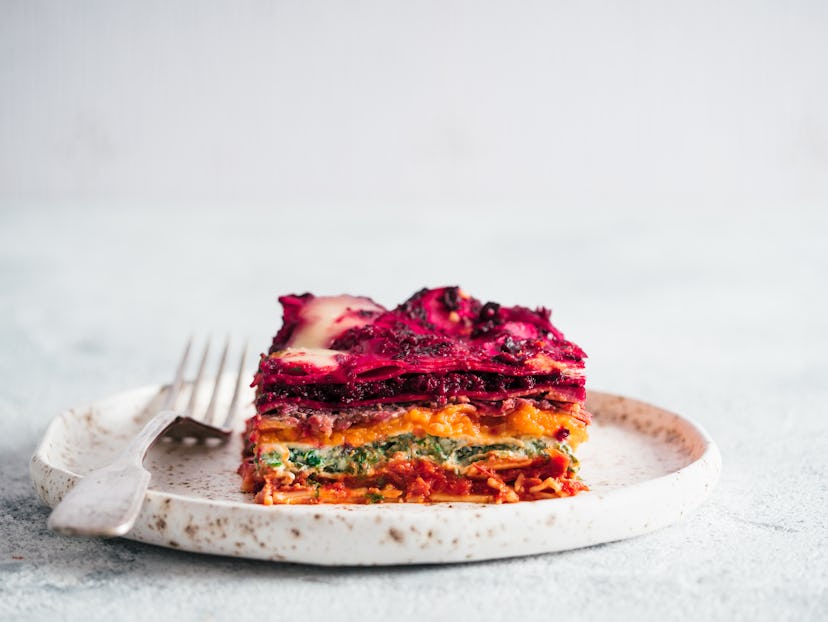 Vegetable Packed Rainbow Lasagne on craft plate.Ideas and recipes for healthy vegetarian dinner or l...