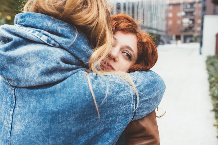 Two young women friends hugging outdoor - friendship, love, 