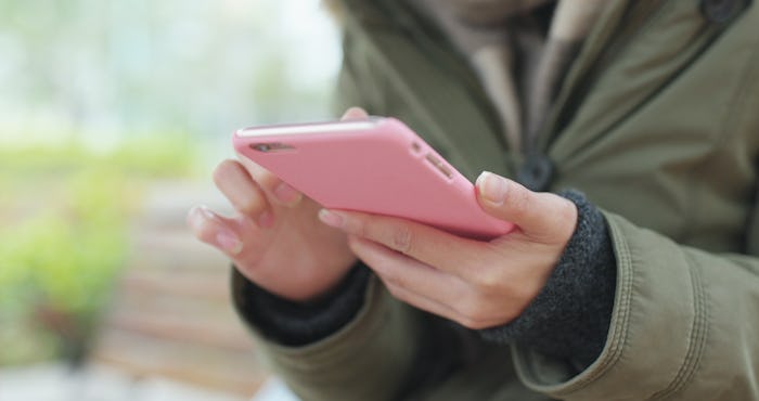 Woman use of mobile phone in the street