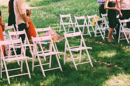 Wedding guests near white chairs on grass. Not drinking at a wedding can be challenging, but there a...