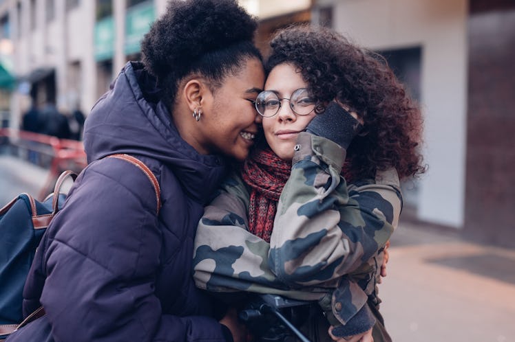 Two women hugging.
