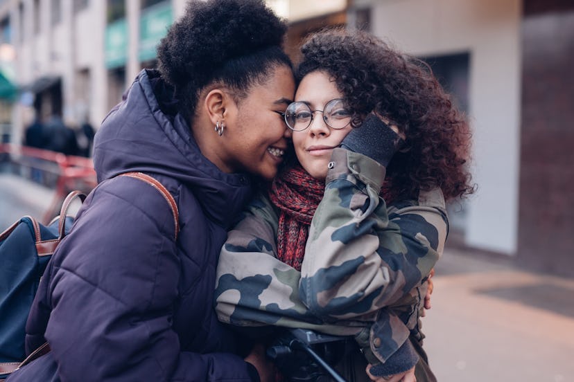 Two women hugging. 