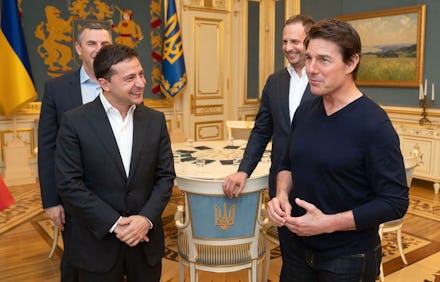 Ukrainian President Volodymyr Zelensky and American actor, film director and producer Tom Cruise tal...
