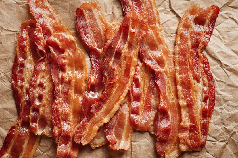Cooked bacon rashers on parchment