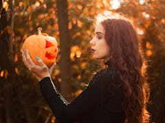 Young autumn fall woman wondering which zodiac signs will be most affected by the October 2021 new m...
