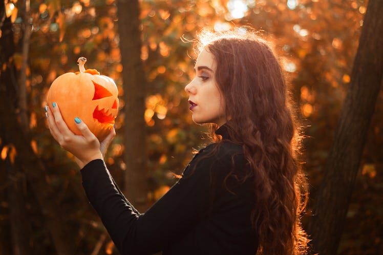 Young autumn fall woman wondering which zodiac signs will be most affected by the October 2021 new m...