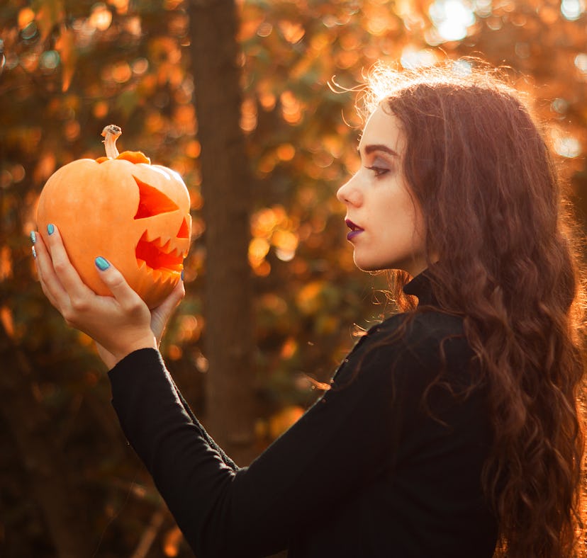Young autumn fall woman wondering which zodiac signs will be most affected by the October 2021 new m...
