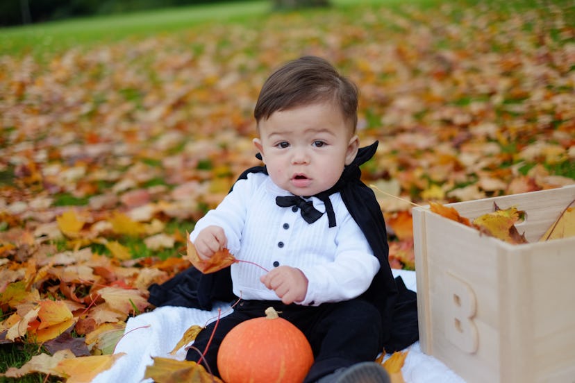 Halloween baby boy in dracula costume.