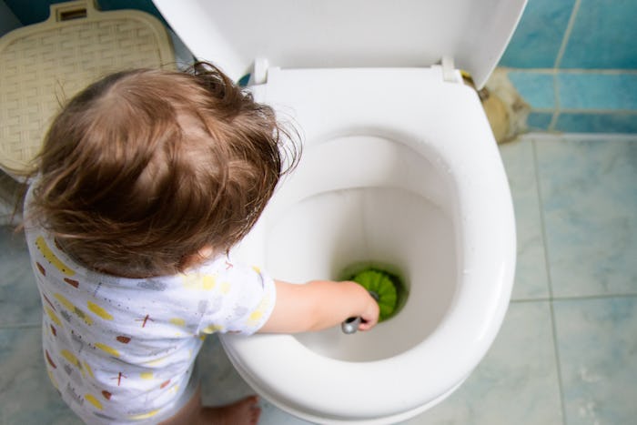 baby and cleaning. help mom with cleaning. toilet and baby. training the child to use the toilet.