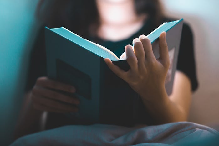 Young woman is reading book