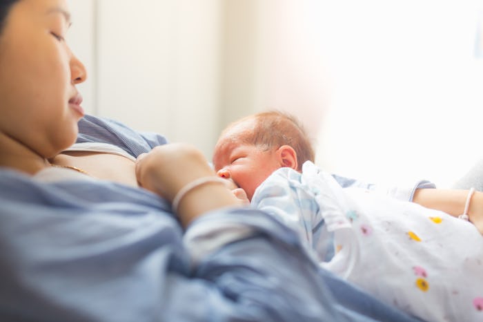 baby is happy at breastfeeding time. it is good for baby to get essential nutrition from milk.
slig...